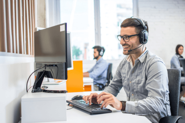 Customer Service Agent Working at Desk