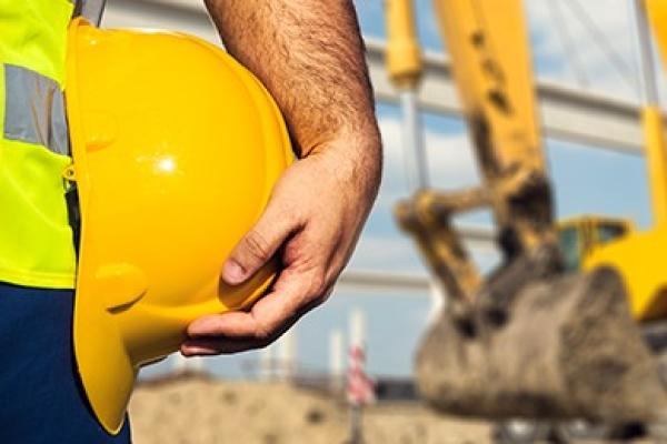Yellow Construction Hat | Construction Site in the Background